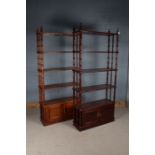 Pair of Oriental inspired open bookcases, each with four shelves on bamboo effect supports, the