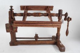 19th century Continental wooden yarn winder, having stretcher base with two uprights and six bar