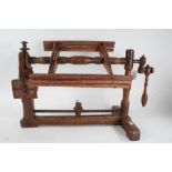 19th century Continental wooden yarn winder, having stretcher base with two uprights and six bar