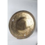 Indian Benares brass tray, with pierced foliate decoration and centred with a bird, 59cm diameter