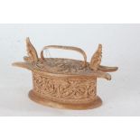 Scandinavian food box and cover, with scroll and foliate carved decoration, 21cm wide