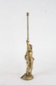 Italian brass figure depicting a solider beside a flagpole, 36.5cm high