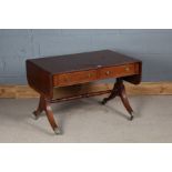 Regency style mahogany low sofa table, the rectangular banded top with D ends, above two frieze