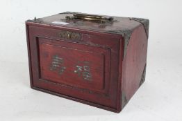 Chinese Mah-Jong set, housed within a hardwood and metal mounted box, the sliding front enclosing