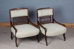 Pair of Edwardian chairs, the banded crest and upholstered back above a pierced splat, the