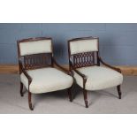 Pair of Edwardian chairs, the banded crest and upholstered back above a pierced splat, the