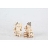 Two Japanese Meiji period carved ivory netsuke, the first in the form of a kneeling man holding a