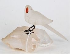 20th century frosted glass bird, with coloured beak and pink eyes, raised on rock crystal, 10.5cm
