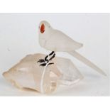 20th century frosted glass bird, with coloured beak and pink eyes, raised on rock crystal, 10.5cm