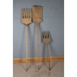 Two homemade carved wooden long handled forks and a shovel (3)