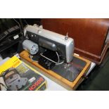 Cased Acadex sewing machine