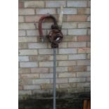"British Make No.1" cast iron water pump, with turned wooden handle, 136cm high