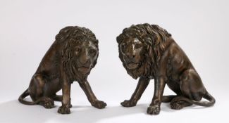 Pair of cast bronze lions, modelled in seated positions, 26cm high - Some white marks between claws