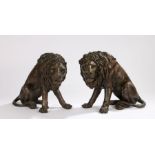 Pair of cast bronze lions, modelled in seated positions, 26cm high - Some white marks between claws