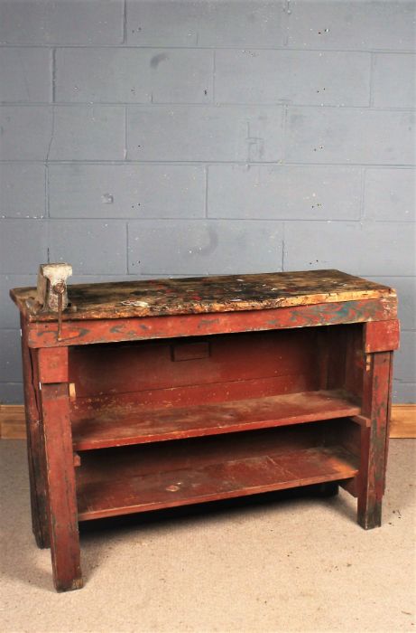 Rustic red painted work bench, with attached vice and two shelves below, 114cm long x 81cm high x