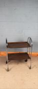 20th Century chrome and teak foldable drinks trolley, marked Pressolit 34 to one of the trays,