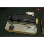 Singer Futura 2000 sewing machine, housed within a plastic carrying case