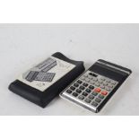 Casio fx-21 Scientific Calculator, housed in a leather case with instruction manual