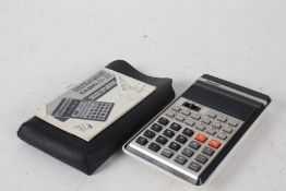 Casio fx-21 Scientific Calculator, housed in a leather case with instruction manual