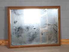 Large 20th Century pine framed wall mirror, with a bevelled glass plate, 134cm x 104cm