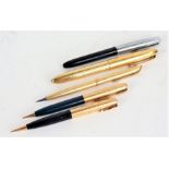 Waterman's propelling pencil, together with an Aurora fountain pen with yellow metal case, a