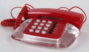 1960's style red and clear plastic dial telephone