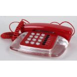 1960's style red and clear plastic dial telephone
