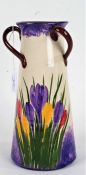 Longpark Torquay pottery vase, the tapering body with triple loop handles and crocus decorated body,