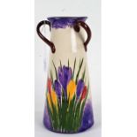 Longpark Torquay pottery vase, the tapering body with triple loop handles and crocus decorated body,