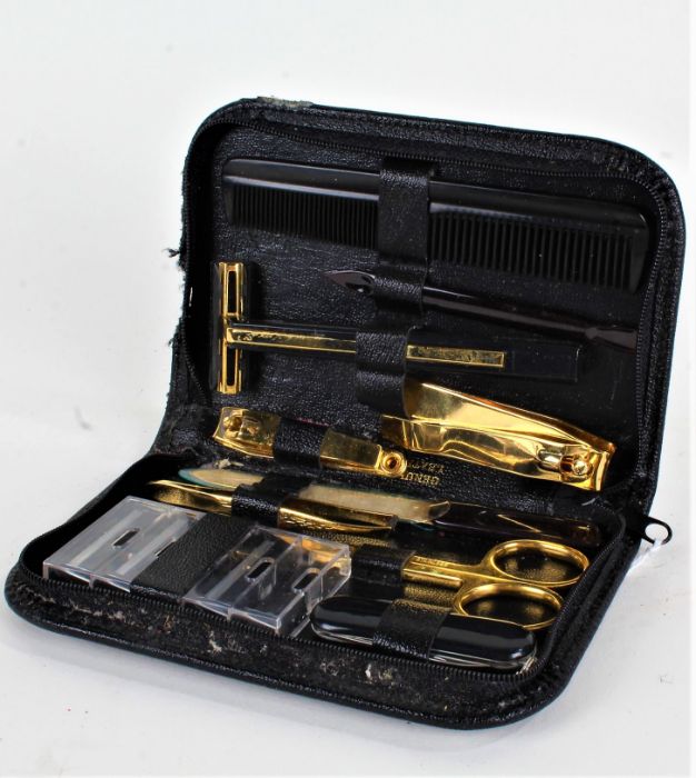Pierre Cardin, leather cased travelling vanity set, comprising razor, comb, scissors, nail file