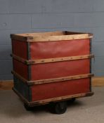 20th century wooden and metal bound mill trolley, raised on four large wheels, 77.5cm wide x 64.