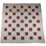Early 20th Century patchwork quilt, with star design to the cream ground, 253cm x 245cm