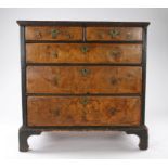 Queen Anne walnut veneered and oak chest of drawers, circa 1710, the rectangular top above two short
