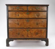 Queen Anne walnut veneered and oak chest of drawers, circa 1710, the rectangular top above two short