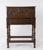 Mid 17th Century oak box on stand, the rectangular lid with zig zag carved decoration to the edge