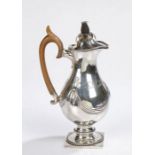 Continental silver hot water jug, possibly Portuguese, the hinged domed cover with pineapple