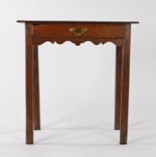 George III oak side table, the rectangular top above a single frieze drawer with carved pediment,