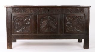 Mid 17th Century oak coffer, West Country, circa 1650, the rectangular three panel top above a