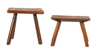 Two 19th Century elm primitive stools, the first with a rectangular top above four angled legs, 32cm