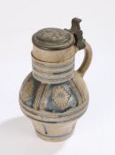 German early 18th Century stoneware jug, Westerwald, the pewter lid with a series of punched numbers