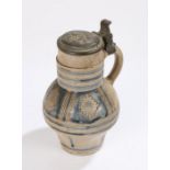 German early 18th Century stoneware jug, Westerwald, the pewter lid with a series of punched numbers