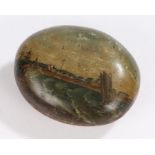Folk art, a painted pebble depicting a sailing boat in stormy seas by a coastal town, 10cm wide