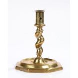 17th Century Spanish candlestick, the pierced socket above a twist stem and wide octagonal base,