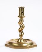 17th Century Spanish candlestick, the pierced socket above a twist stem and wide octagonal base,