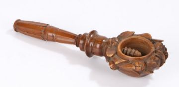 19th Century cedar wood carved nutcrackers, as a bouquet of flowers and screw thread cracker, 21.5cm