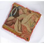 A large cushion of 18th century tapestry, designed with a classically draped youth holding a