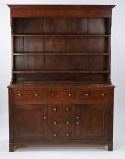 George III oak dresser and rack, circa 1800, the rack with a concave cornice above three shelves,