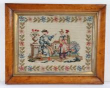 19th Century woolwork picture, of a couple in Oriental costume in a garden, housed within a maple