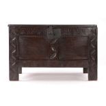 Small Charles II oak coffer, Devon, circa 1660, the rectangular top above a lunette carved frieze