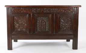 An unusual Charles II oak coffer, Cumbria, dated 1681, having a triple-panelled lid, the front